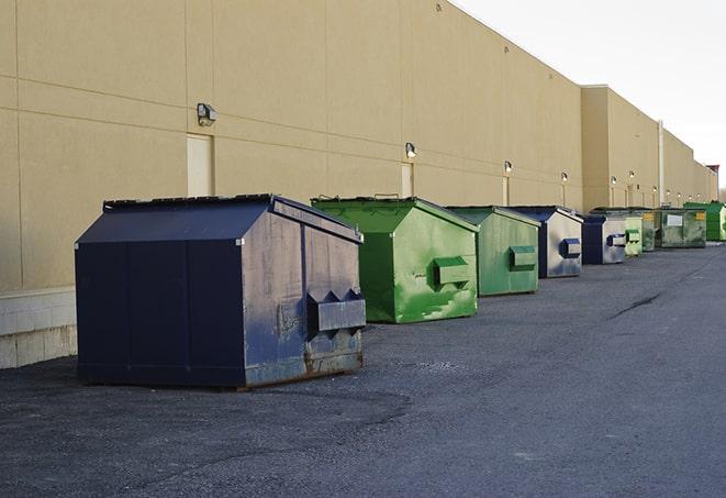 metal dump boxes positioned for construction cleanup in Brickeys